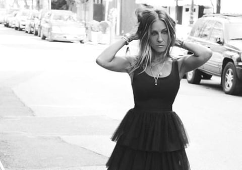 Sarah Jessica Parker in her little black dress, which will be on sale at the store. 