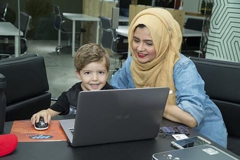 Four-year-old Jonas learns the basics of code from Fariha Khan in Dubai in April 2017. 