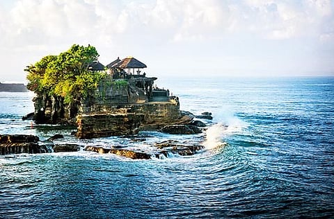 The 16th-century Tanah Lot sea shrine in Bali has been shaped continuously by the ocean tide. 