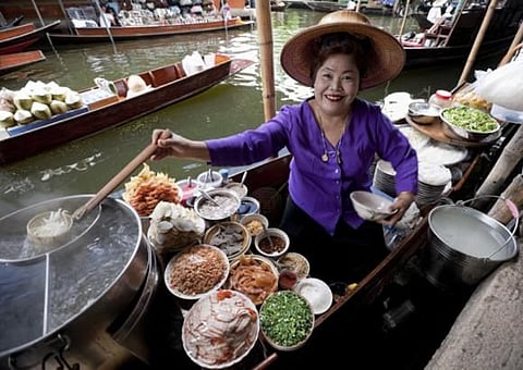 It’s a food-lover’s paradise – eat at one of Bangkok’s floating markets. 