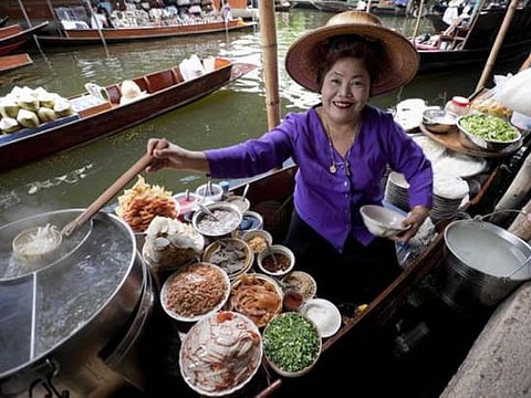 It’s a food-lover’s paradise – eat at one of Bangkok’s floating markets. 