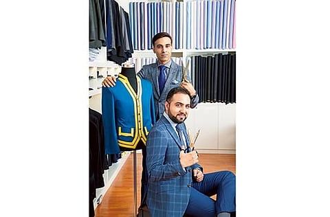 Tailors Ashish (seated) and Pawan. 