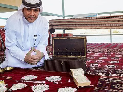 Abdullah Al Suwaidi displays the huge variety of pearls that have been harvested from Al Rams’ waters 