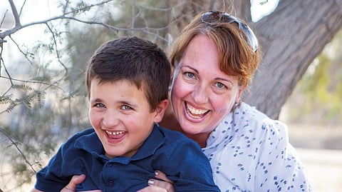 Emily initiated the Smile with Sam photo project to capture Sam and other people along with pets of determination 