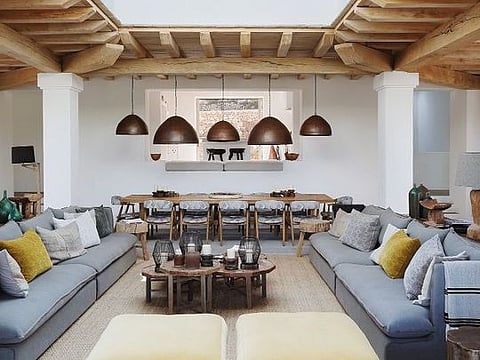 The living room is based on a Megaron, an architecture form found in ancient Greece. The large square room has a central skylight so you can look up and see the sky while the interior is open to the exterior vertically. In this case, the room can be opened on three sides. The symmetry of the set up is very appealing