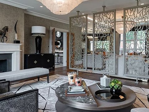 The striking bespoke dividers create privacy without breaking the flow of the open-plan family room, while the tonal use of colour and variety of texture and pattern adds interest, tactility and depth. 