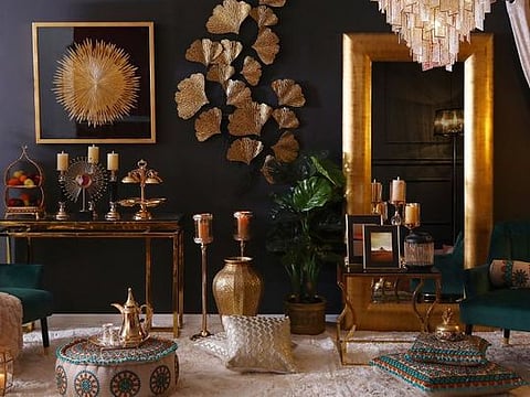 This Ramadan collection from Pan Emirates features bold decor ideas including a sparkling chandelier, golden gingko leaf wall decor and embroidered poofs and cushions