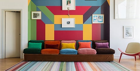 The 'Festival' rug from The Rug Company features a kaleidoscope of colours illustrating their bold effect on interior decor