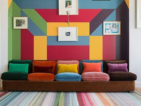 The 'Festival' rug from The Rug Company features a kaleidoscope of colours illustrating their bold effect on interior decor