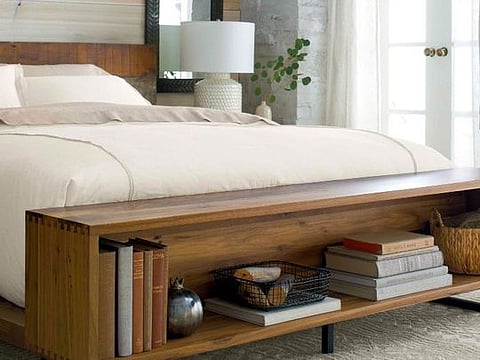 This unusual Crate &amp; Barrel bed includes a small shelf that acts as a modern take on the usual blanket box placed at the bottom of the bed.