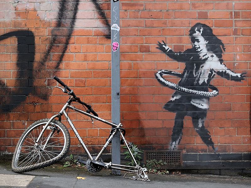 British artist Banksy claims hula-hooping girl street art