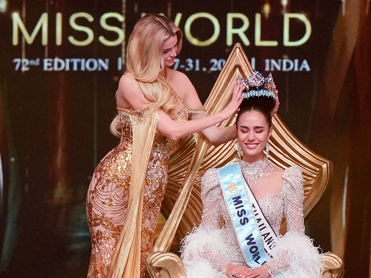 Krystyna Pyszkova of Czech Republic, left, crowns her successor Opal Suchata of Thailand after she who won the 72nd Miss World pageant in Hyderabad, India, Saturday, May 31, 2025. 