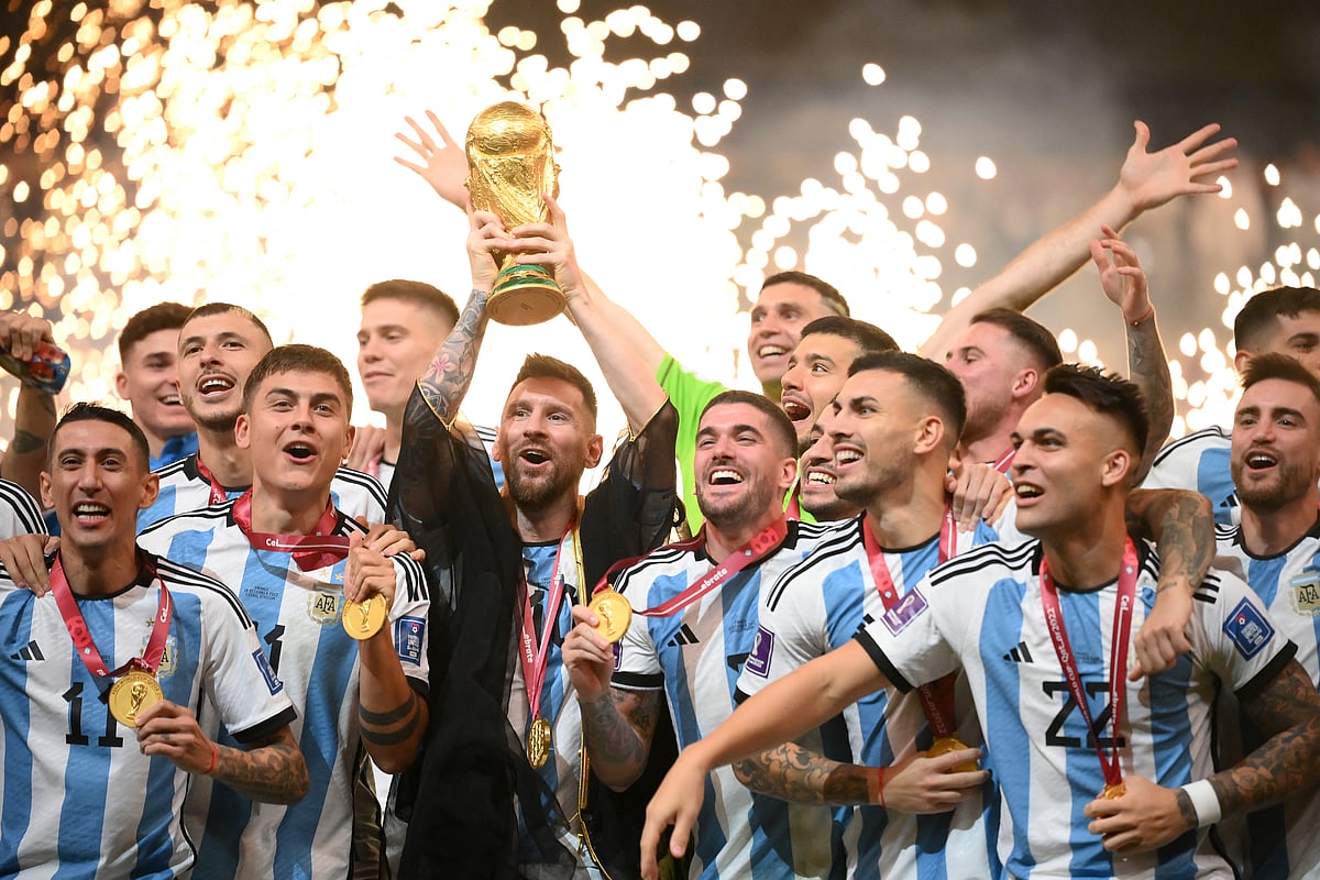 Argentina's forward #10 Lionel Messi lifts the World Cup trophy during the Qatar 2022 World Cup trophy ceremony after the football final match between Argentina and France at Lusail Stadium in Lusail, north of Doha on December 18, 2022. Argentina won in the penalty shoot-out.