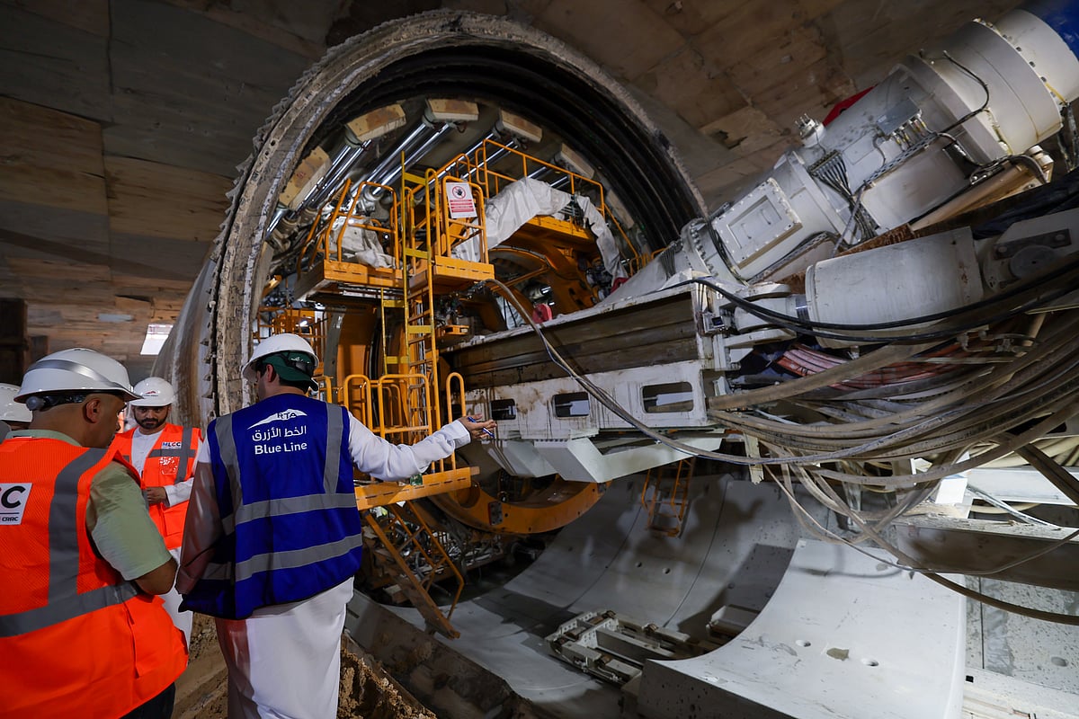 A massive cylindrical tunnel boring machine sits in a concrete shaft ready to excavate the new Dubai Metro line.