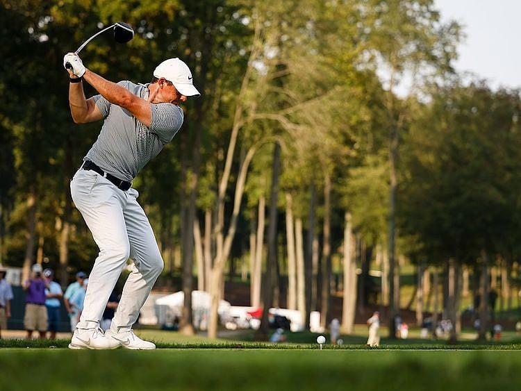 Rory McIlroy plays his shot from the 15th tee during the first round of the BMW Championship 