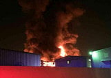 Massive fire guts two warehouses