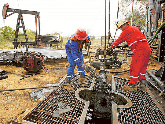 Oil set for biggest monthly gain on output cuts, Fed