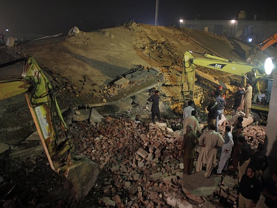 Pakistan building collapse: 18 workers dead. 150 trapped