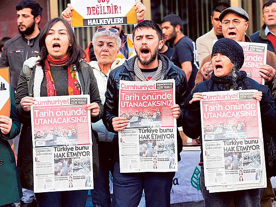 Turkey’s oldest national daily defiant after arrests