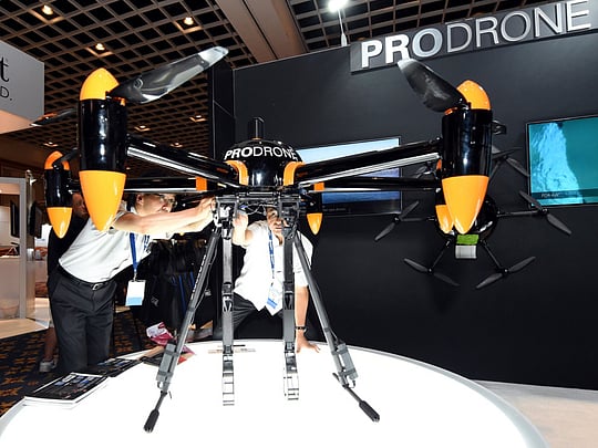 Clawed robot takes to the sky, and takes off with a chair