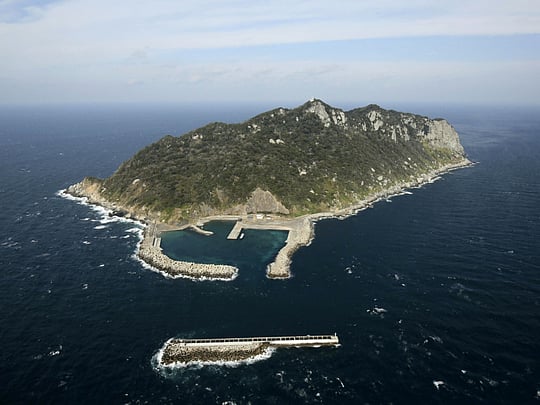 A sacred Japanese island juggles secrecy and survival