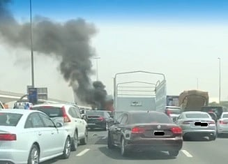 Heavy traffic as vehicle burns on Dubai road following multi-vehicle ...