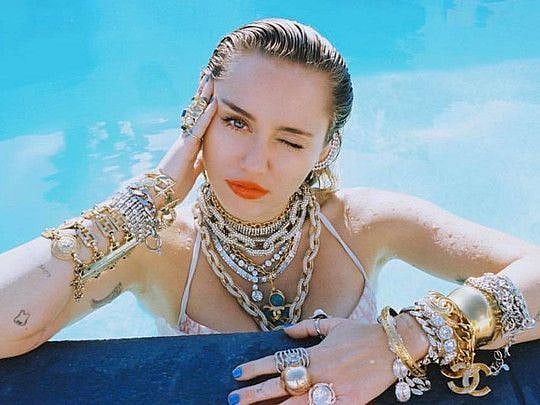 Miley Cyrus was grabbed by a fan who tried to kiss her.