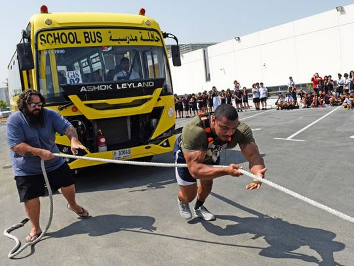 Bus Pulling In pictures: Strongman Larry Williams pulls 9-tonne school bus in Dubai