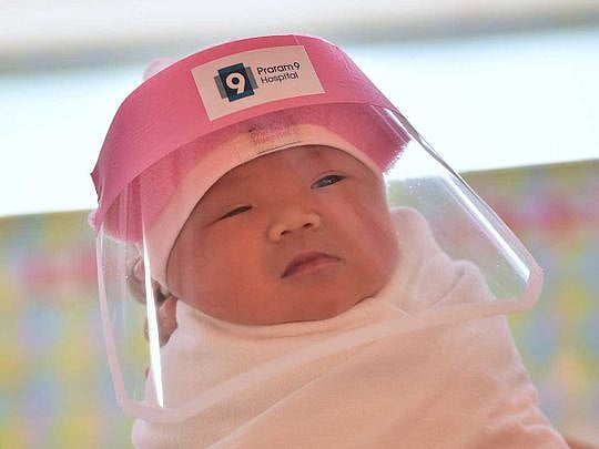 Tiny face shields given to newborn babies in Thailand to fend off COVID-19