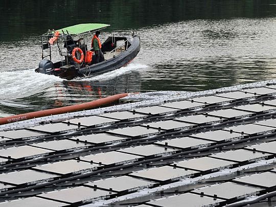 Space-starved Singapore builds floating solar farms in climate fight