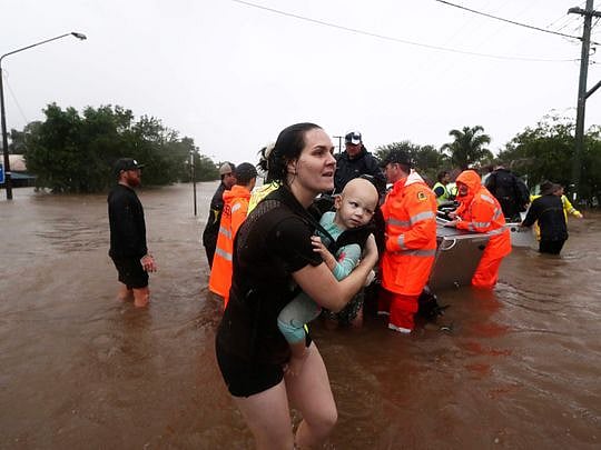 Rooftop rescues in Australia as tens of thousands evacuated from floods