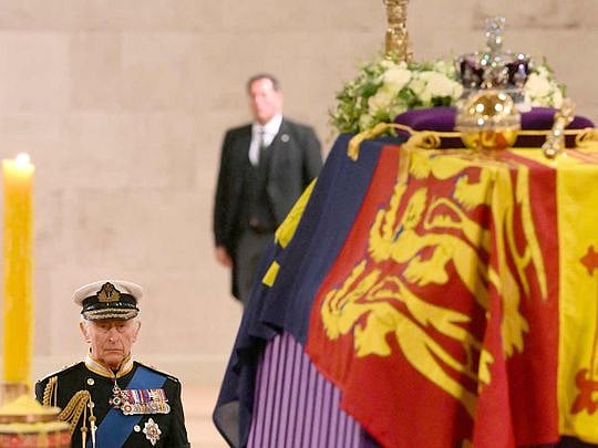 King Charles stands vigil as Queen's lying-in-state queue swells