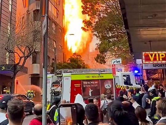 Massive fire erupts in seven-story building in Sydney