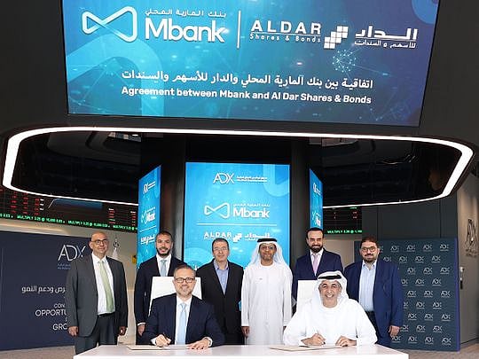 ADX hosts signing agreement between Mbank and Al Dar Shares & Bonds to ...