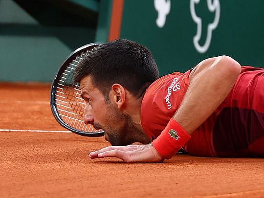 Djokovic shrugs off injury, pips Cerundolo in another French Open epic