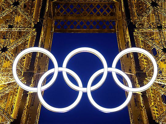 Photos: Paris hangs its Olympic rings on the Eiffel Tower