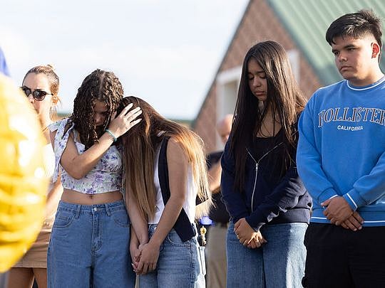 US school shooting: Father charged along with son in killing 4