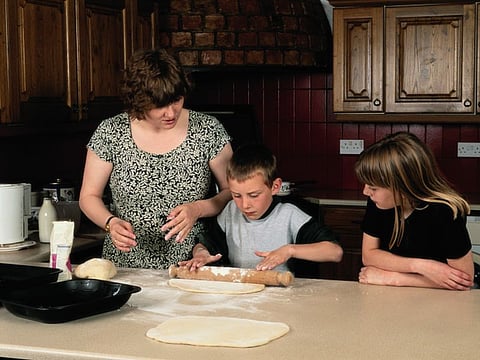 kids with mother in the kitchen
