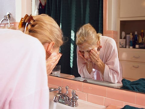 woman washing face