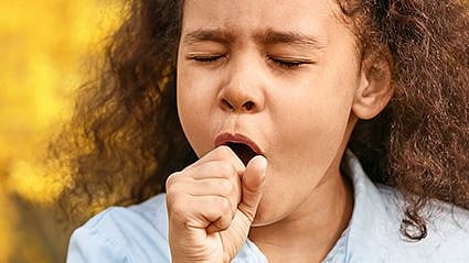 a girl coughing