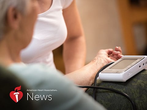 Senior woman having blood pressure taken