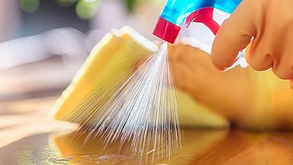 a person sraying the counter