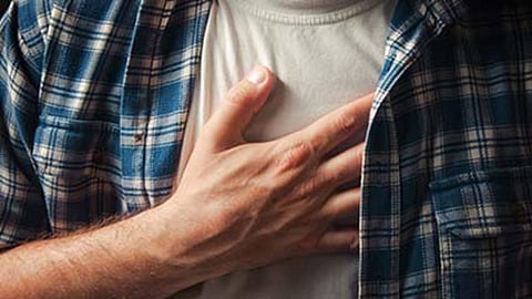 holding chest in pain