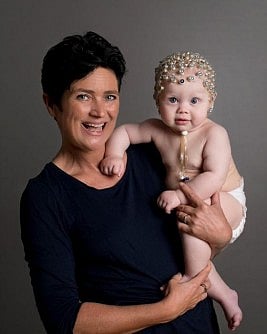 Study author Audrey Van Der Meer cradles baby involved in research