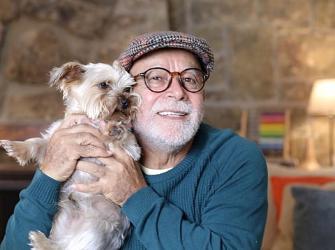 A Happy Elderly Person with a Pet Dog