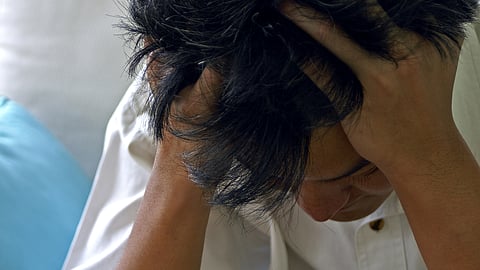 Man holding head, headache,  brain pain