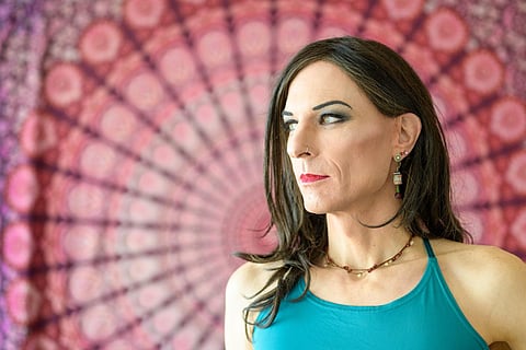 Close up portrait of a thoughtful transgender looking to the side