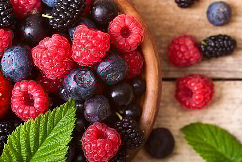 different fresh berries as background