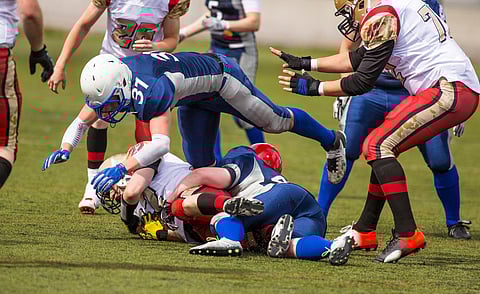 Photo of football players playing in a game