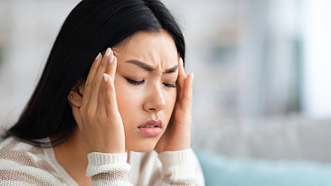headache migraine asian woman